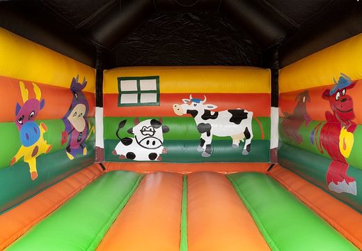 Zamów standardowy dmuchany zamek dla dzieci w efektownych kolorach z dużym trójwymiarowym obiektem krowy na wierzchu. Nadmuchiwany zamek na sprzedaż online w JB Dmuchańce Polska